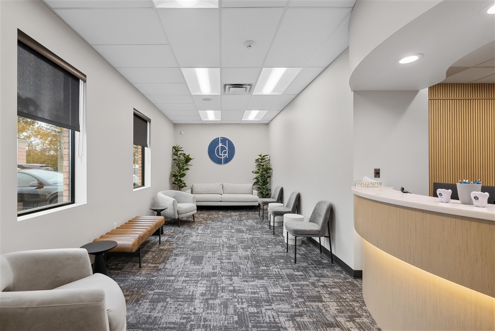 Modern and welcoming dental office lobby at Lance Family Dental in Festus, MO, featuring comfortable seating and a professional front desk for patient check-in.