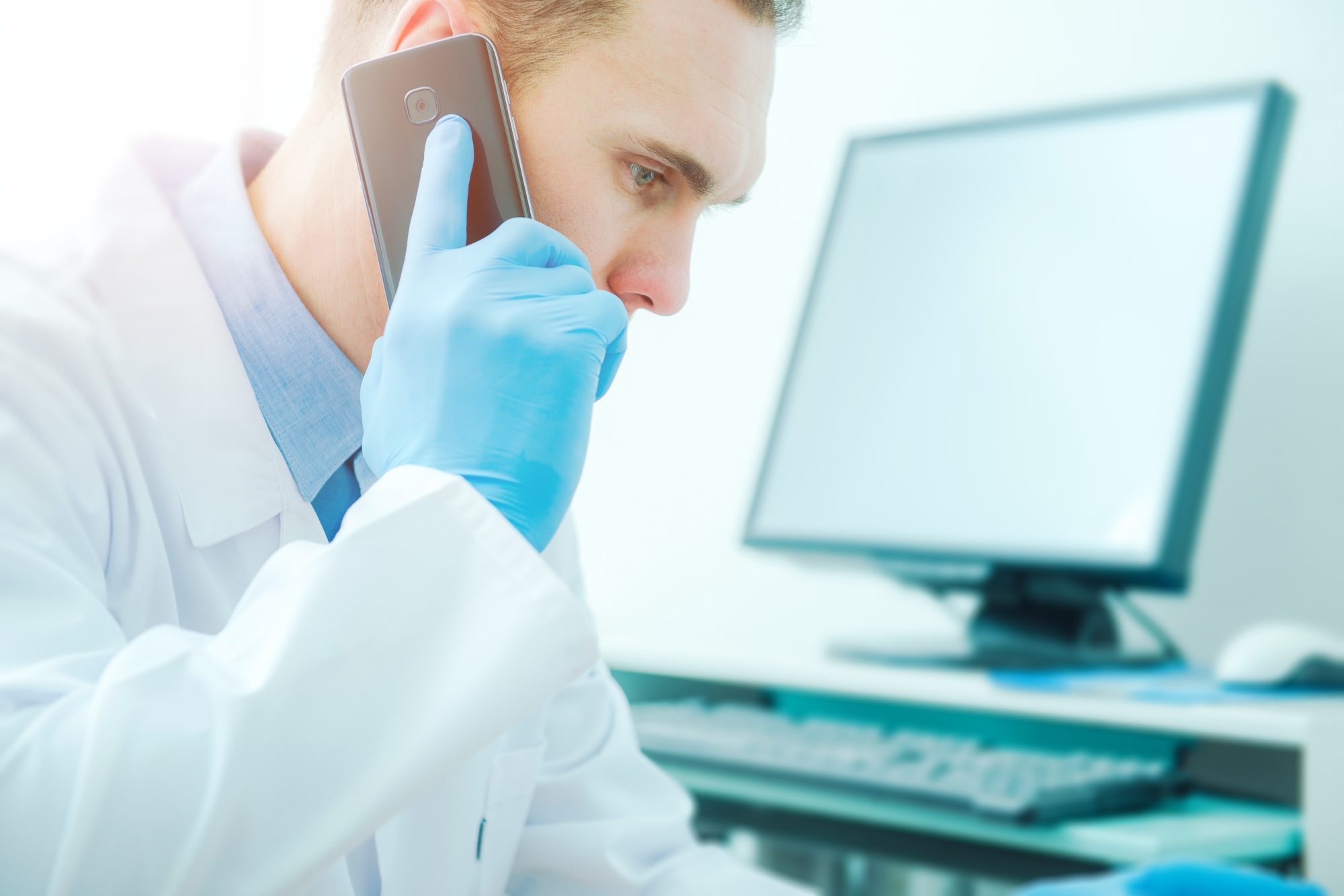 Dentist providing a second opinion over the phone at Lance Family Dental in Festus, MO